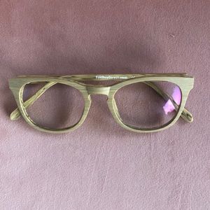 Wood-grain effect eyeglass frames.